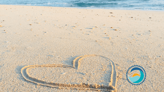 Valentine's Day, Heart drawn in sand on beach with ocean in the background, Valentine's Day, Heart drawn in sand on beach with ocean in the background