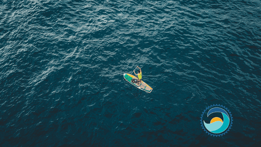 Person Paddleboating In Ocean, Which Can Be Impacted By Titanium in Sunscreen,