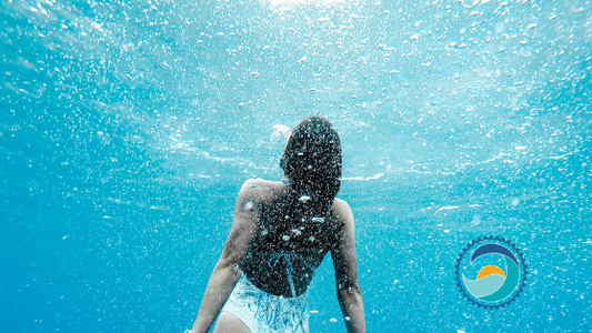 , Four children splashing in the ocean