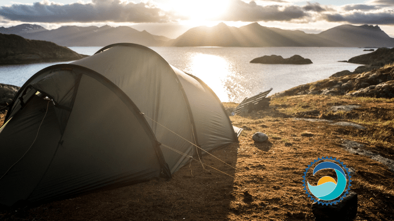 ecoconscious camping, tent next to cliff at sunrise, morning routine, woman meditating on beach