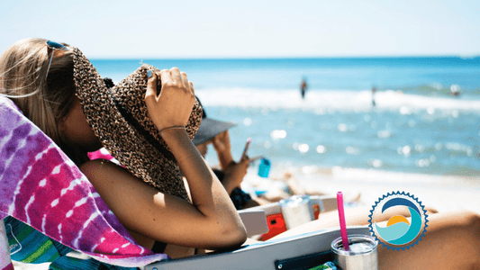 Oxybenzone - girl covering face with hat on beach