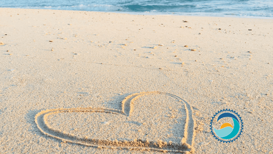 Valentine's Day, Heart drawn in sand on beach with ocean in the background, Valentine's Day, Heart drawn in sand on beach with ocean in the background