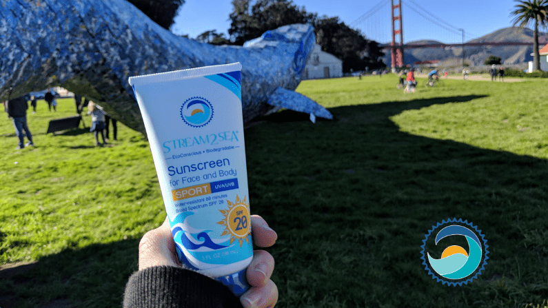 eco-concious, stream2sea sunscreen in a sunny park, Showing Sunscreen cream for Face and Body - Stream2Sea