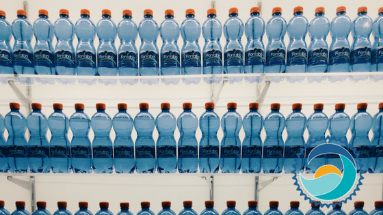 Waterbottles lined up on three shelves across the entire frame